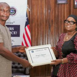 The Minister of Foreign Affairs, Her Excellency Sara Beysolow Nyanti, certificates a retiree
