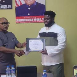 Hon. Sirleaf R. Tyler  Certificates Mr. Selikie Sesay as First Liberian to Drive from France to Liberia by Land.