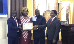  (IFAD) Country Representative Madam Pascaline Barankeba receiving a certificate of Appreciation from the government of Liberia